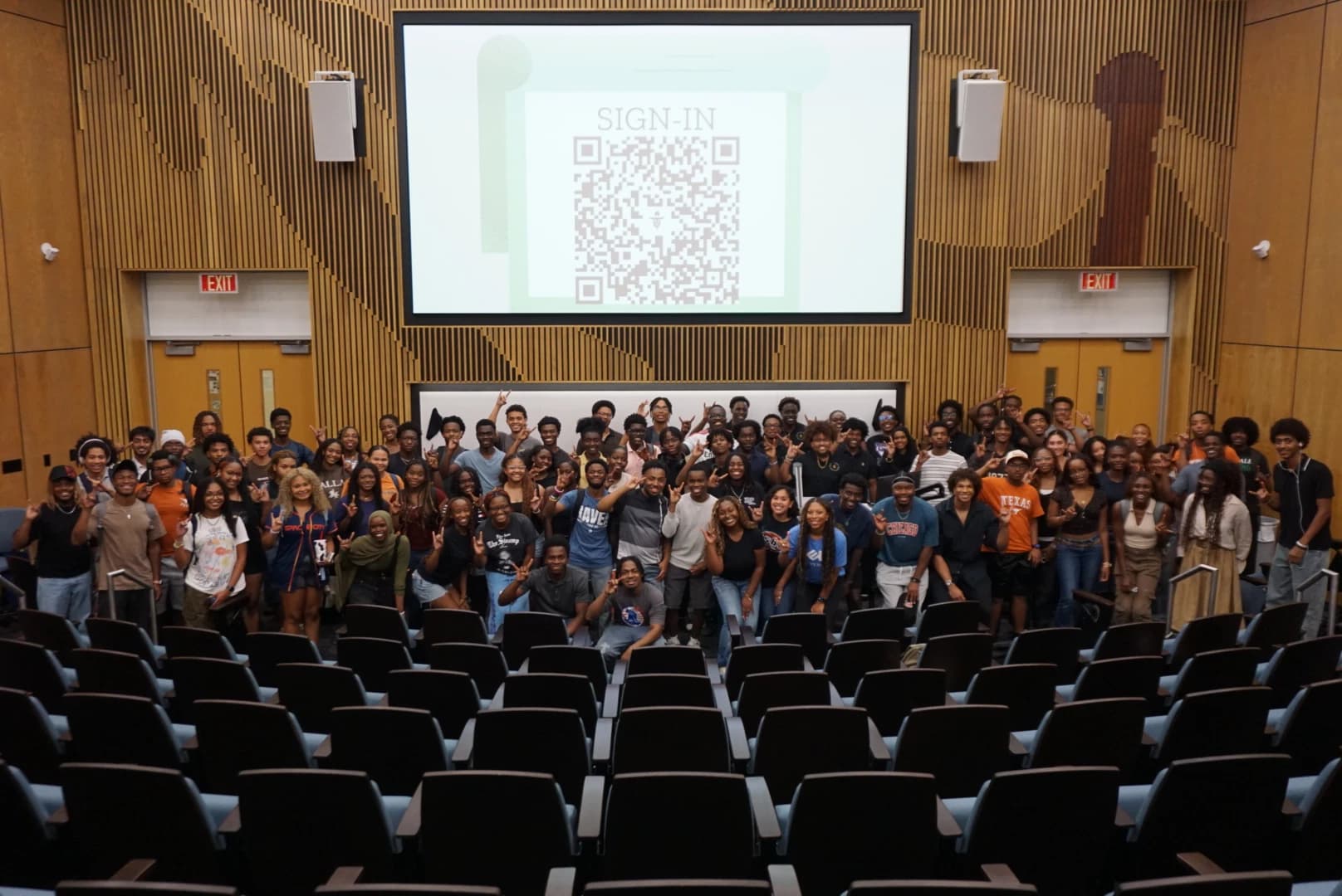 Texas NSBE members gathered for a chapter group photo in a lecture hall