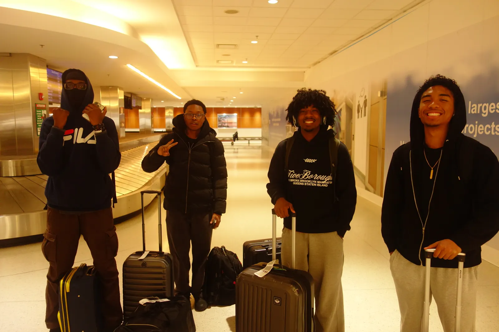 Texas NSBE members with luggage in a hotel corridor on the way to national convention