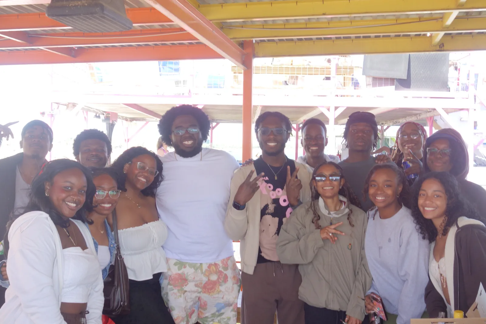 A large group of Texas NSBE members posing together on the lake day boat