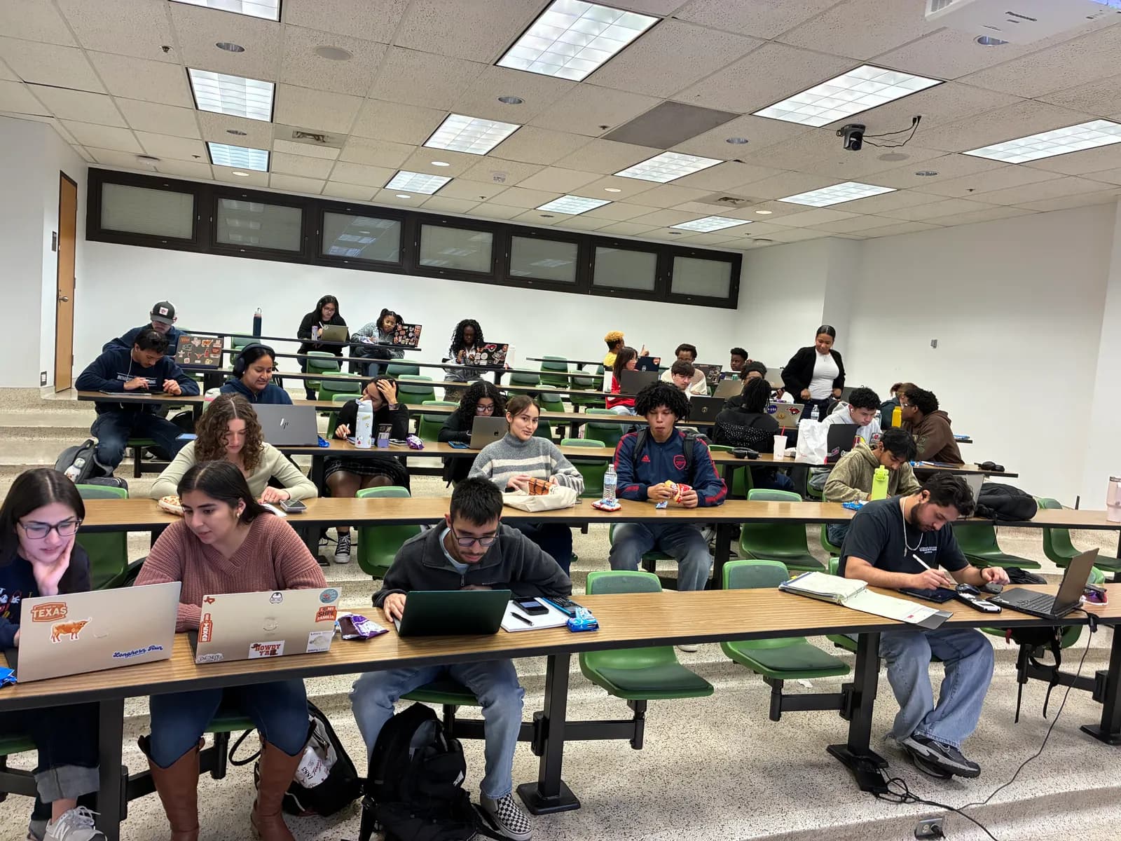 A wide view of NSBE members studying across a tiered classroom